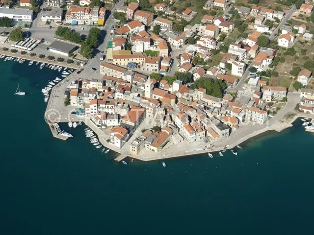 Aerial view of old stone house for renovation with sea view in Pirovac