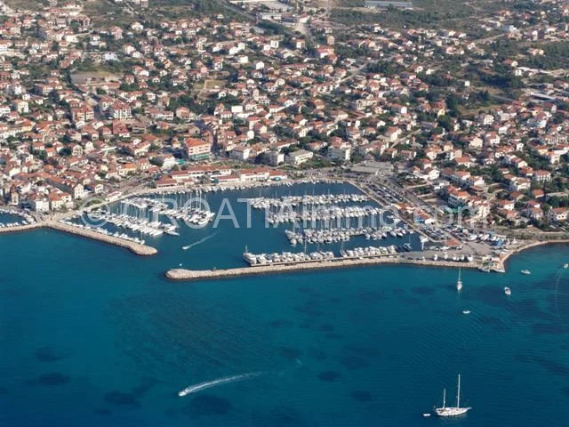 Aerial view of old stone house for renovation with garden in Vodice